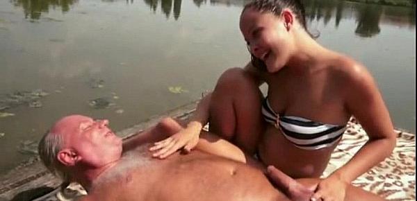  Dolly Diore has a golden shower with an old man by the lake